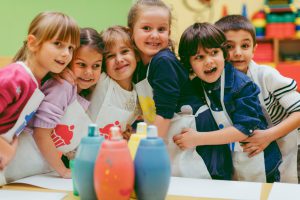 Portrait of Children Painting With Watercolors